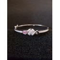 Sterling silver bangle with clover flowers and Zircon gemstones.