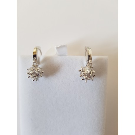 Sterling silver earrings with Zircon gemstone encased in square brackets.